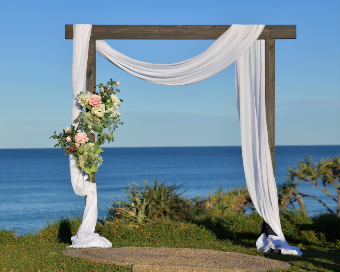 elopement arbor choice 
2 post black wood arbor with draped cloth and faux flowers
